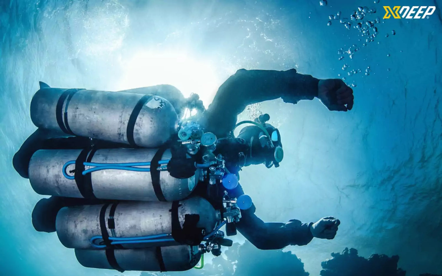 Diver in Xdeep sidemount wing with multiple tanks