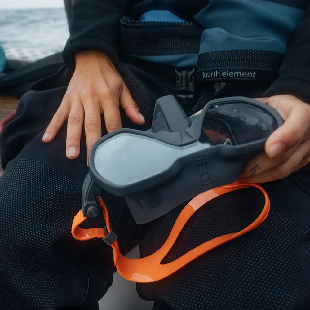 Person holding a Fourth Element Seeker Mask