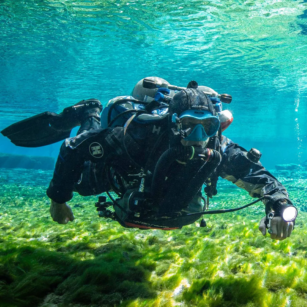 Halcyon Diver underwater with scuba gear in clear blue water