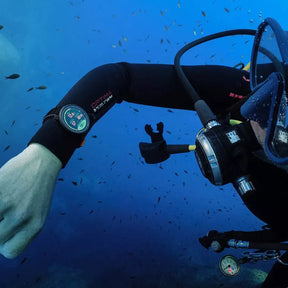 Suunto Nautic S Dive Computer on divers arm underwater