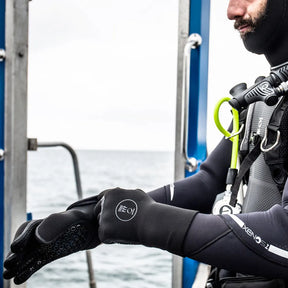 Diver wearing Fourth Element Gloves