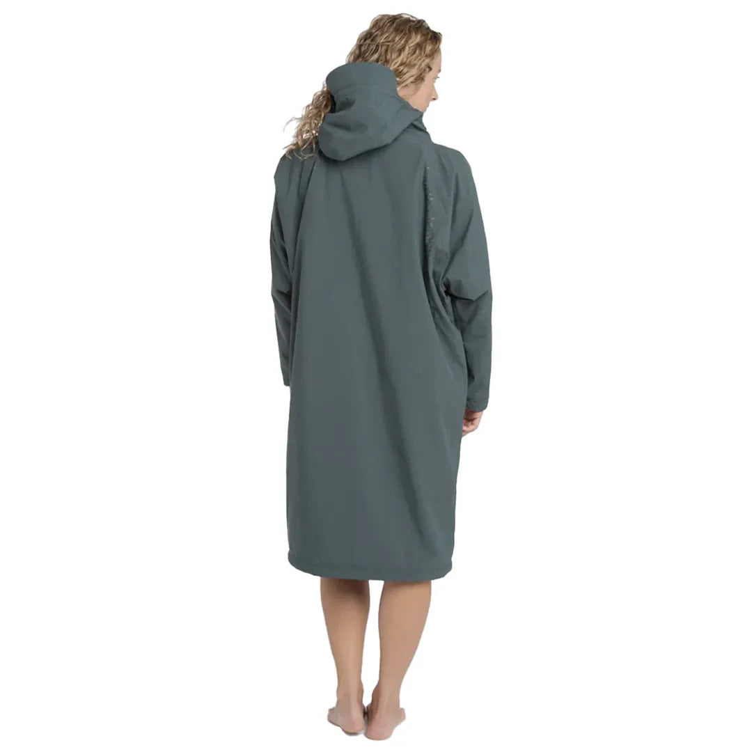 Back image of woman wearing the green Fourth Element Tidal Robe  