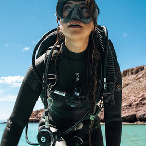 Scuba Diver in a Women's Fourth Element Xenos ARC Wetsuit.