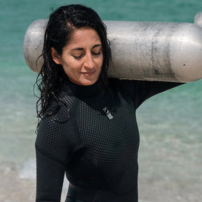 Scuba diver wearing a Fourth Element Xenos ARC 3mm Wetsuit.