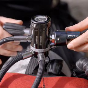 Diver attaching Shearwater Swift GPS Transmitter to regulator